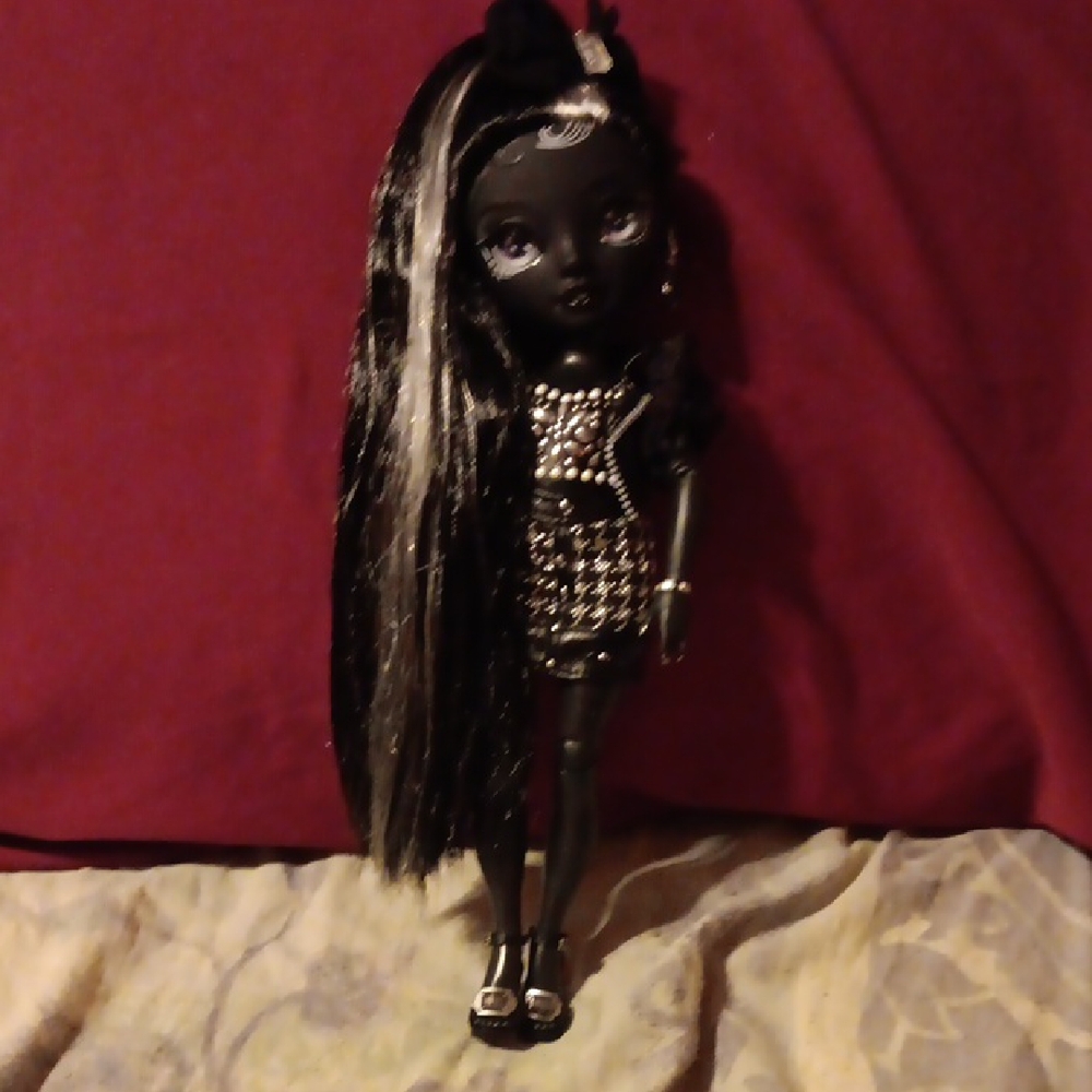 Stylish Black and White Doll with Bow